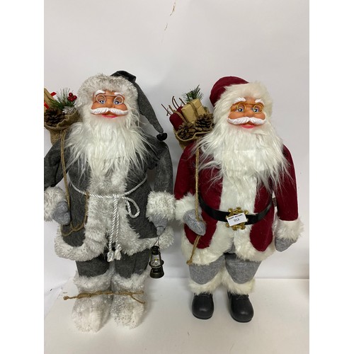 953 - Pair of Studio standing Father Christmas's measuring 62 cms tall