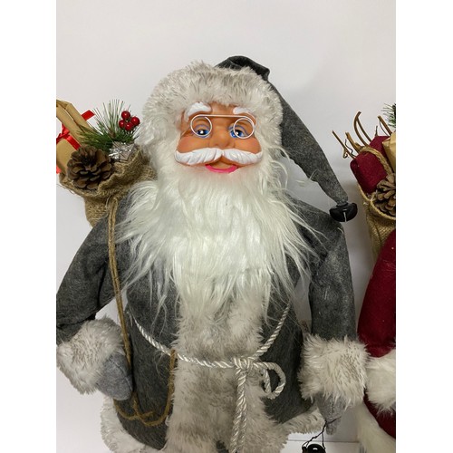 953 - Pair of Studio standing Father Christmas's measuring 62 cms tall