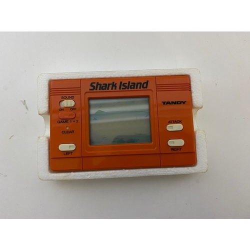 776 - Vintage Tandy Shark Island boxed mint condition handheld electronic game with instruction booklet. C... 