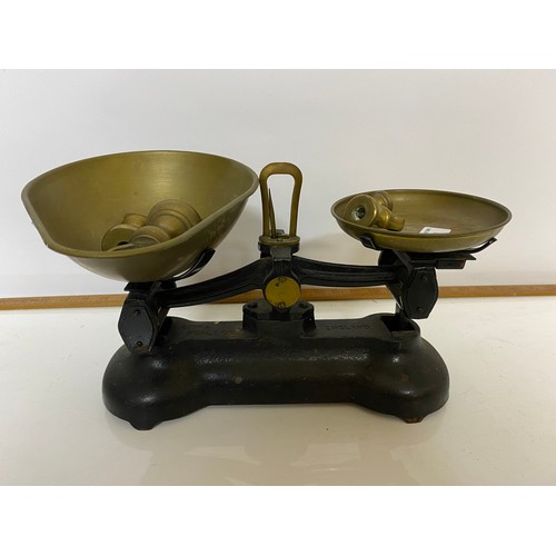 199 - A set of Libra cast iron and brass scales complete with brass weights