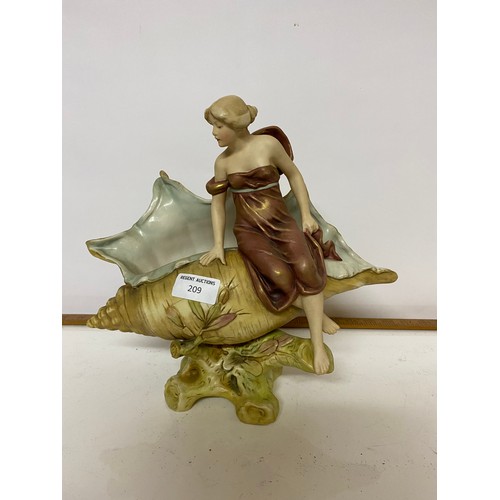 209 - Royal Dux figurine of maiden seated on a shell measuring 28 cms tall, some cracks to shell and face.