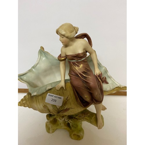 209 - Royal Dux figurine of maiden seated on a shell measuring 28 cms tall, some cracks to shell and face.