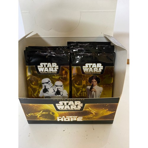 268 - Star Wars A New Hope TCG, box of 15 sealed packets, containing 7 common cards, 3 uncommon cards and ... 