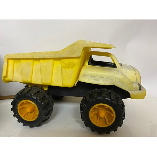 69 - 2 large plastic dump trucks