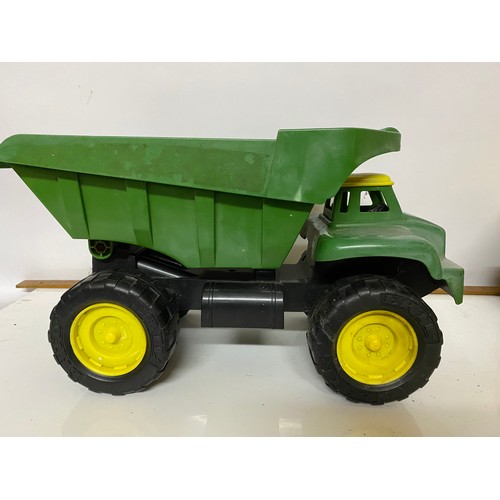 69 - 2 large plastic dump trucks