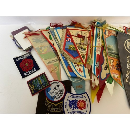 33 - Collection of vintage pennants and patch badges