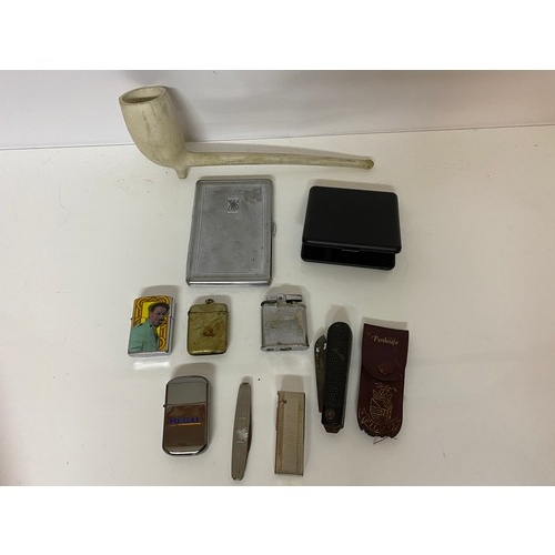 41 - Collection of tobacciana including vesta, lighters, cigarette cases, clay pipe, knives etc