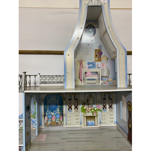 180 - Modern dolls house/castle measuring 82 x 135 cms tall