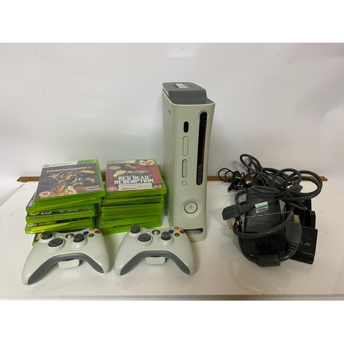 401 - White Xbox 360 with 2 controllers  and dock, leads and 15 games. Fully tested and working