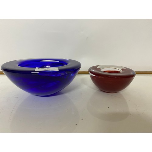 395 - 2 x Kosta Boda glass dishes, largest measuring 17 cms diameter