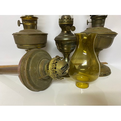 438 - 4 x antique brass oil lamps with original glass funnels