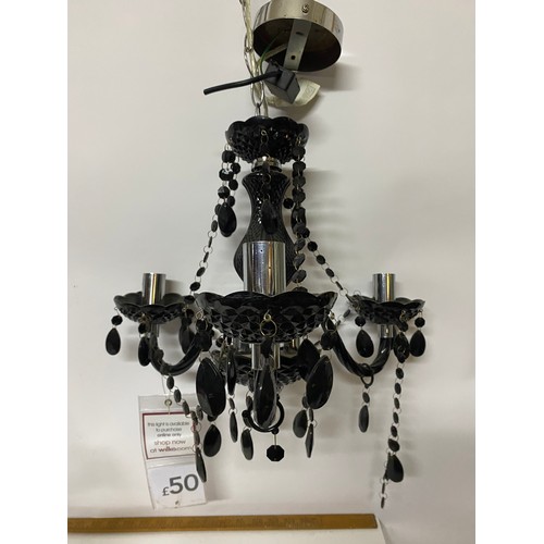 310 - 2 x 3 arm plastic chandelier, one clear and one in black measuring 33 cms tall