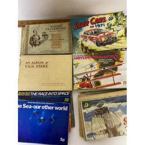 36 - Large box of trade cards including cigarette cards, tea cards etc