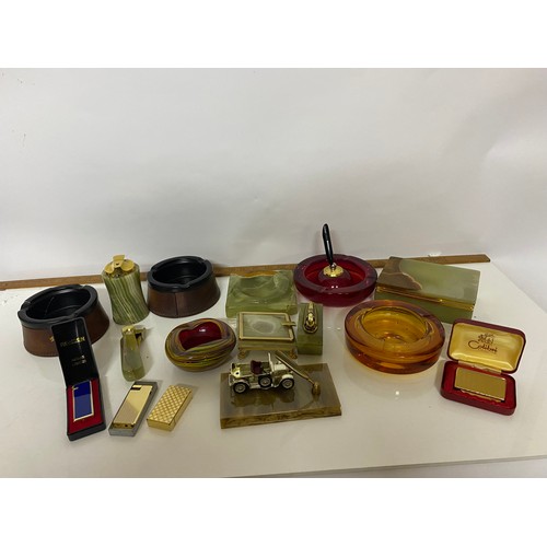 457 - Selection of tobaciana including onyx ashtrays and lighters, glass ashtrays and onyx cigarette box