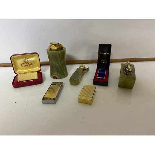 457 - Selection of tobaciana including onyx ashtrays and lighters, glass ashtrays and onyx cigarette box