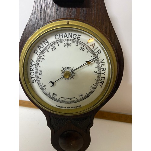 461 - Aneroid Barometer in dark wood surround. 59cms