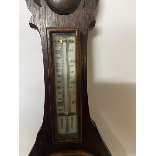 461 - Aneroid Barometer in dark wood surround. 59cms