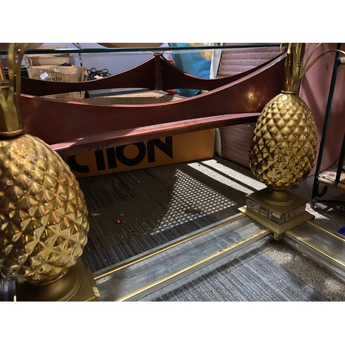 439 - Coffee table in glass and gold tone metal with pineapple legs. Measuring 70 cms square. Missing nuts... 