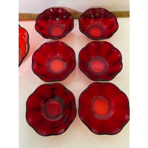 351 - Red glass dessert set comprising of 6 bowls and 1 large bowl.