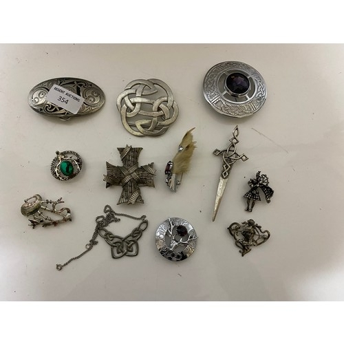 354 - Selection of Celtic style jewellery including belt buckles and brooches