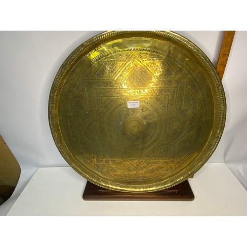 590 - Large brass tray on stand 58cms across.