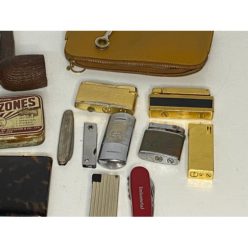 596 - Collection of Tobaccoana including lighters, pipes, cigarette cases and ashtrays.