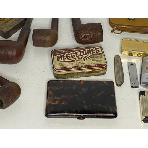 596 - Collection of Tobaccoana including lighters, pipes, cigarette cases and ashtrays.