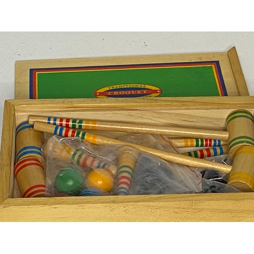 604 - Selection of vintage indoor games including carpet bowls, Golden Boules and Croquet.