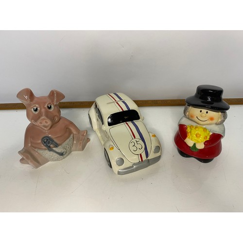 607 - Collection of retro money boxes including Nat West Pigs and Herbie, all with stoppers.