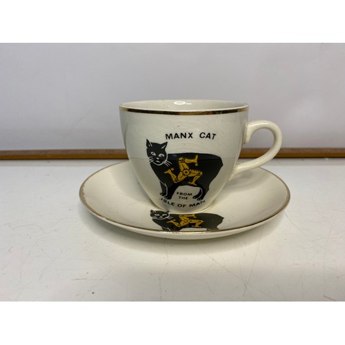 617 - Collection of vintage porcelain cats, plates and Isle of Man cup and saucer.