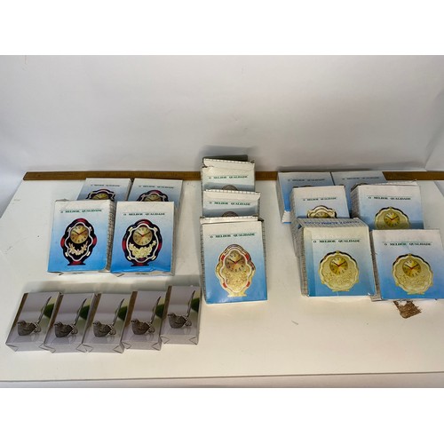 651 - Selection of boxed alarm clocks in 3 different styles and 5 bird ring holders