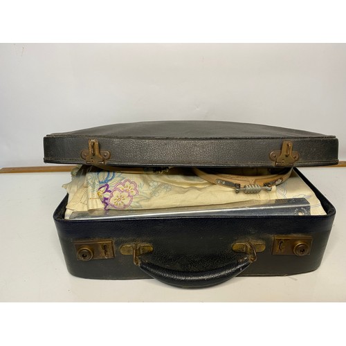 665 - Vintage black case filled with selection of embroidery items including silks, rings, patterns and li... 