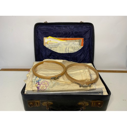 665 - Vintage black case filled with selection of embroidery items including silks, rings, patterns and li... 