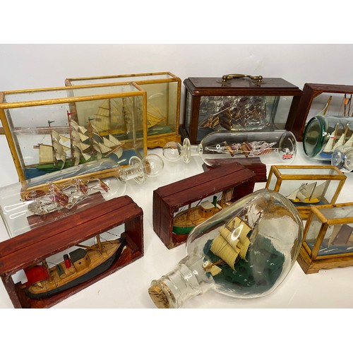 672 - Selection of glass boats in bottles and glass cases