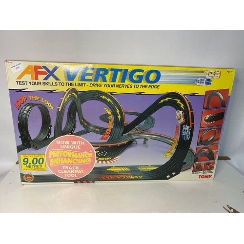 679 - Tomy AFX Vertigo boxed racing set