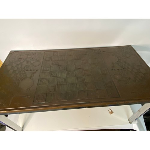 689 - Mid century wood and chrome chess board carved coffee table 90x47cms