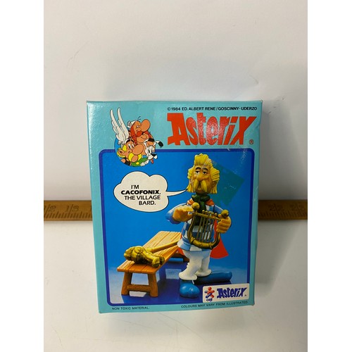 722 - Vintage Play Asterix, boxed complete Cacofonix. Figure is sealed new condition in packaging. Made by... 