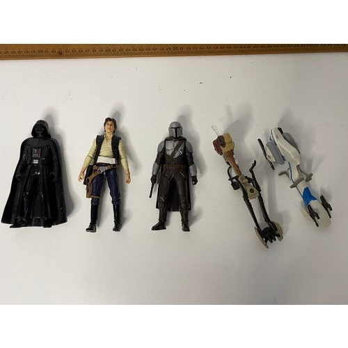 561 - Assortment of Star Wars figures including Darth Vader, Hans Solo, Mandalorian Beshor and some vehicl... 