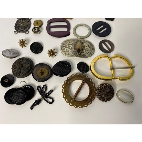 699 - Selection of vintage buckles and buttons.