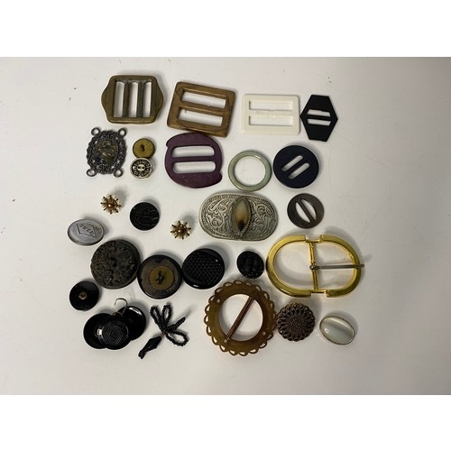 699 - Selection of vintage buckles and buttons.