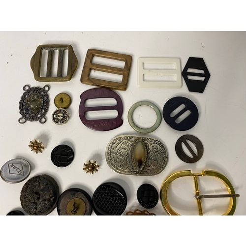 699 - Selection of vintage buckles and buttons.