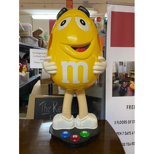 677 - Large shop display M&M's character on wheels. 95cms tall