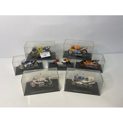 948 - Selection of 7 model motorbikes in display cases from Honda, Suzuki, Yamaha and Ducati.