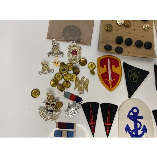 567 - Collection of Military badges and patches.