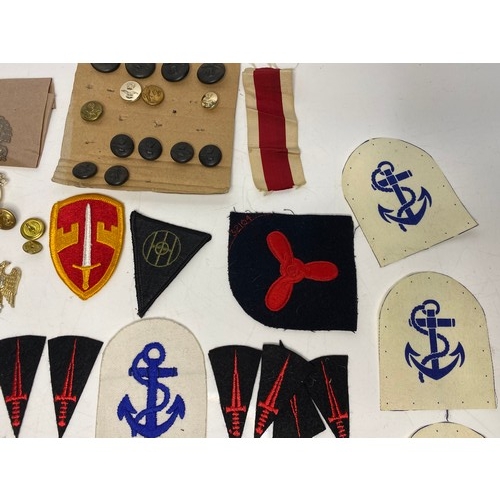 567 - Collection of Military badges and patches.