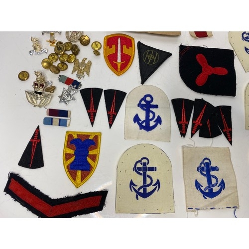 567 - Collection of Military badges and patches.