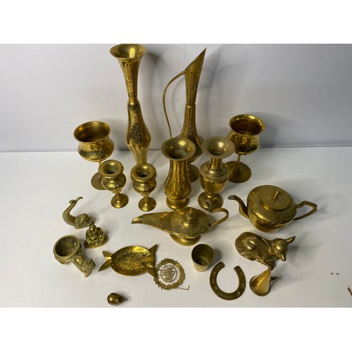 104 - Selection of brassware including urns, goblets, a pair of bud vases and others.