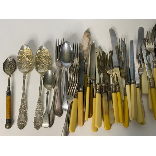 124 - Selection of old cutlery including fish knives and forks, spoons and decorative spoons.