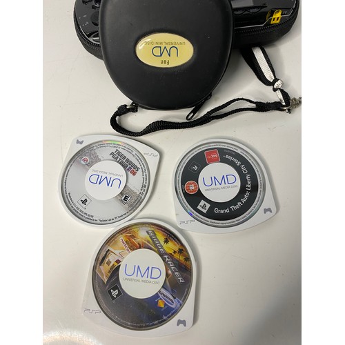 125 - Sony PSP with games and leads.