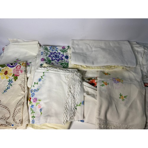 181 - Large selection of vintage tablecloths and linen.